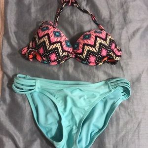 Patterned bathing suit top with light blue bottoms